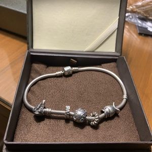 Pandora bracelet with fish charms. 9 inches